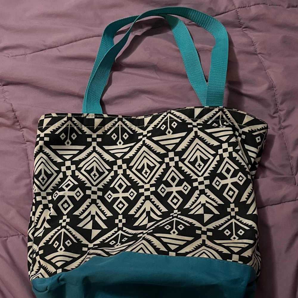 Stylish Black and White Patterned Tote Bag with Blue Accents